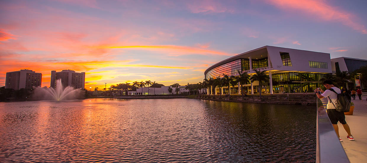 A photograph of the Shalala Student Center at sunset on the University of Miami Coral Gables campus.